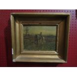 A gilt framed print with oil on top depicting a man riding horses in rural landscape indistinctly