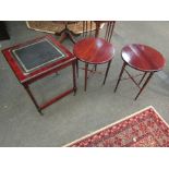 A set of three reproduction mahogany side tables including green tooled leather insert example and