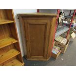 A Victorian pine wall hanging corner cabinet with shelved interior,