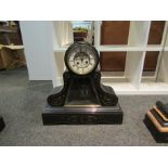 A late Victorian black slate mantel clock,