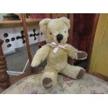 A small jointed mohair Merrythought teddy bear with original label to foot pad 25cm high