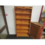 A modern pine full height bookcase with cloverleaf pierced design 190cm x 86cm x 26cm