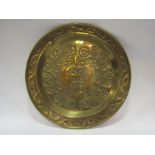 A large stipple engraved floral brass charger,