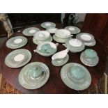 A selection of Chinastyle dinner wares, grey ground and white floral design lidded tureens etc.