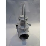 A white painted locomotive headlamp with burner and reservoir,