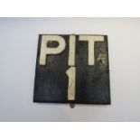 A wooden wall mountable drainage pit marker 'PIT1',