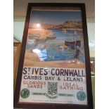 A framed and glazed early reproduction of a GWR travel poster depicting St Ives Cornwall after