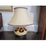 A Moorcroft table lamp base, cream ground with Art Nouveau floral design,