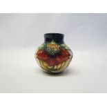 A Moorcroft Anna Lily pattern squat form vase, WM monogram to base, 9cm tall,
