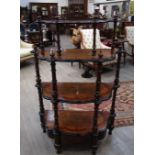 A Victorian burr walnut four tier whatnot with fretwork gallery, turned spindle supports,