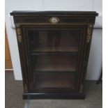 A Victorian ebonised pier cabinet with ormulu mounts and Sèvres panel, velvet lined interior,