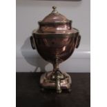 A Regency copper samovar with brass decoration, brass handles with Egyptian motif and brass tap,