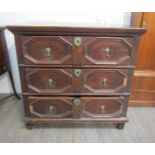 A late 17th/early 18th Century chest of three straight drawers with applied mouldings and drop