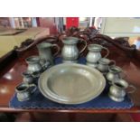 Ten pieces of bygone pewter comprising of tankards and a plate