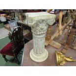 A Corinthian column form stand,