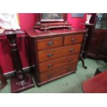 A circa 1900 round cornered mahogany chest of two short over three graduating long drawers,