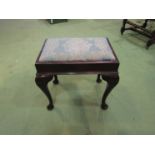 A circa 1900 oak stool the drop-in needlepoint seat over pad foot cabriole legs