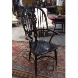 A circa 1900 Windsor hoop back elbow chair with wheel splat,