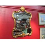 An ornate gilt framed mirror, 87cm x 60cm total, together with a bevel edged pine example,