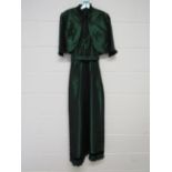 A 1950's green shot taffeta evening dress with matching bolero