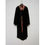 A 1920's black velvet evening coat,