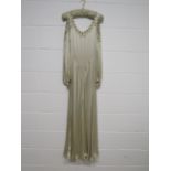1930's cream satin evening dress decorated with beads and sequins to the shoulder neckline and