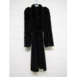 A 1940's black wool coat with textured wool faux fur sleeves,