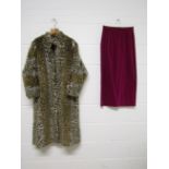 A 1980's faux leopard fur fabric coat and a cerise velvet 3/4 length skirt with gathered detail to