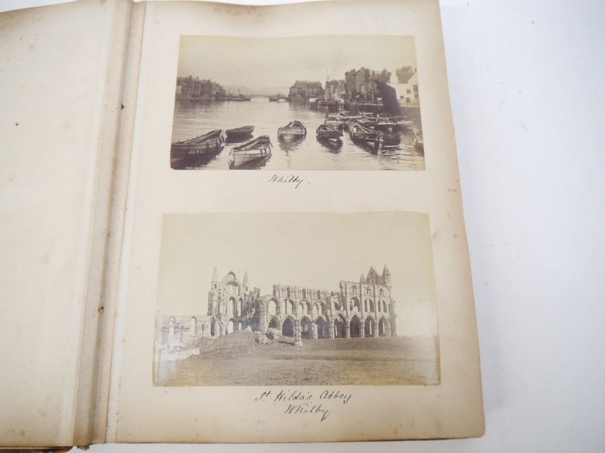 A Victorian photograph album containing over 130 mainly albumen print mounted photographs, c.