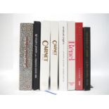 (Fashion) A collection of eight books showcasing fabrics used by fashion designers,