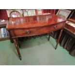 A circa 1840 flame mahogany bow front side table the single frieze drawer on turned and tapering