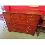 A 19th Century mahogany chest of two short over three graduating long drawers with brass swan neck