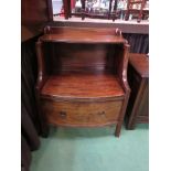 An early 19th Century mahogany bow front nightstand, the open shelf over a single base drawer,