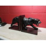 A pair of leather black panther bookends