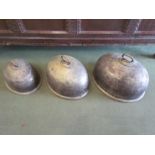Three Cross Arrows silver plate meat covers, dents present,