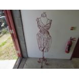 A red wirework floor standing mannequin,