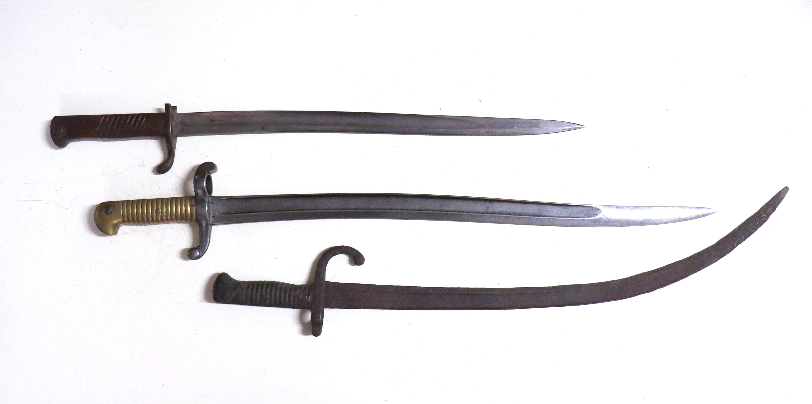 A French Model 42T sabre bayonet, a later French example modified and corroded,