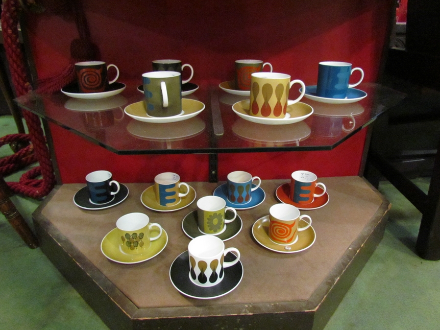 14 Susie Cooper for Wedgwood coffee cans and saucers of varying colours and bold designs