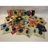 A box of 1950's and 1960's 7" singles and EP's including Gene Vincent, Zoot Money, Eddie Cochran,