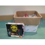 A box of assorted Rock and Pop 7" singles including Status Quo, Motorhead, ELO, etc (approx.