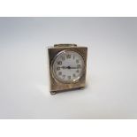A silver cased miniature clock with Arabic numerals, Birmingham 1945, 5cm x 4.