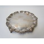 A Goldsmiths & Silversmiths Company silver salver with scallop and pie crust edge,