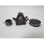 A circular silver lidded trinket box, miniature Continental twin handled vessel,