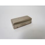 A white metal snuff/trinket box with gilt interior of rectangular form, 2cm x 6.