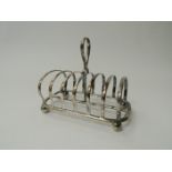 A Mappin & Webb silver seven bar toast rack, Sheffield 1918, 15cm long,