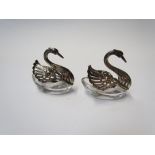 A pair of silver and glass salts of swan form, marked 925,