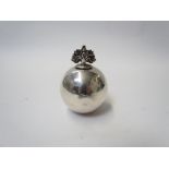 A Mappin & Webb silver counter balanced pounce pot of spherical form, London 1930, dented,