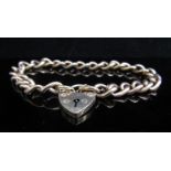A 9ct gold charm bracelet with locket clasp, 18.
