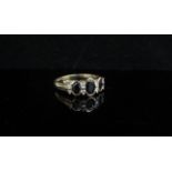 A gold blue sapphire and diamond ring, stamped 9k. Size T, 2.