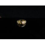 A gold ring stamped 18ct, stones missing. Size O, 5.